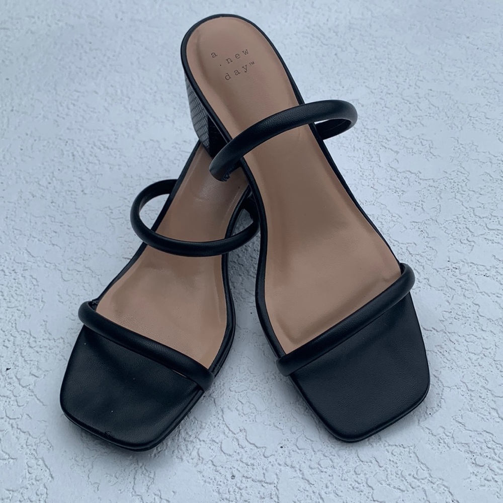 Black strappy sandals with platform heel.